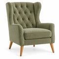 Sillón tapizado con botones decorativos y respaldo alto, verde y marrón